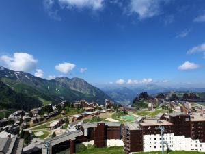 a view of a city with mountains in the background at Appartement Avoriaz, 2 pièces, 5 personnes - FR-1-314-213 in Morzine