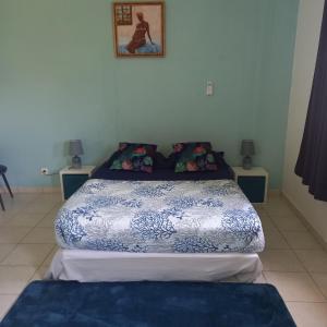 Postel nebo postele na pokoji v ubytování Le Moule Location saisonnière Bel appartement + 6 fotografií