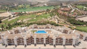 an aerial view of a resort building with a pool at Zen Garden Apartment in Vera