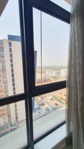 an open window with a view of a city at iTowers Studio-Suite in Gaborone