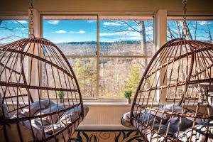 two hanging hammocks in a room with a window at Mtn Views - Sauna - Hot Tub - Health - Wellness in Massanutten