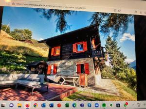 a painting of a house with red windows at Chalet Edelweiss à Saint-Martin, Val d'Hérens in Saint-Martin