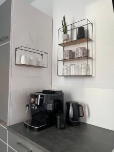 a kitchen with a coffee maker on a counter at Tiny House im Spreewald in Kittlitz
