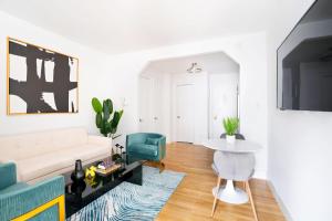 a living room with a couch and a table at 444-3A Newly renovated 1BR - Elevator Building in New York