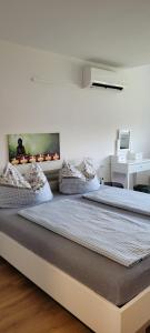 two beds sitting next to each other in a room at Ferienwohnung Stoisser in Mureck +25 photos