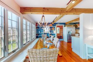 a dining room with a table and chairs at Topgallant in Wiscasset