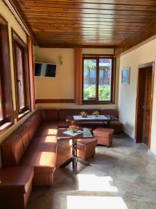 a living room with a couch and a table at Iglika Bansko in Bansko