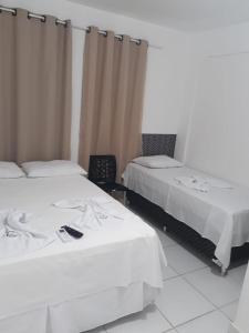 Giường trong phòng chung tại FLAT PANTANAL