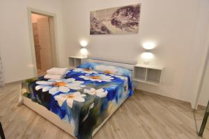 A bed or beds in a room at Casa Romeo