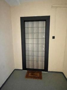 a door in a room with a mat in front of it at LOVEly Home&Lake in Balatonfüred