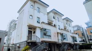 an apartment building with stairs in front of it at Huis One in Lekki