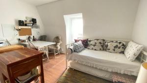 a living room with a couch and a table at The Parkdale Hostellerie in Toronto