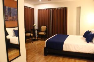 Postel nebo postele na pokoji v ubytování Hotel PLATINIUM