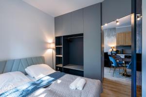 Ένα ή περισσότερα κρεβάτια σε δωμάτιο στο Blue Harmony Apartment