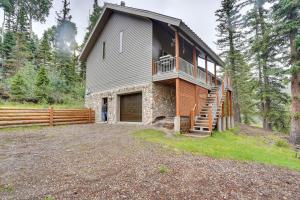 a house in the woods with a large yard at Spacious Beaver Getaway Near Eagle Point Resort! in Beaver