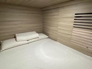 מיטה או מיטות בחדר ב-Capsulas La Sin Ventura