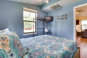 a bedroom with blue walls and a bed at St Cloud Vacation Rental - Walk to Lakefront Park! in Saint Cloud