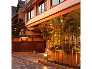 a building with a sign on the side of it at Hamachiyokan - Vacation STAY 56027v in Ise