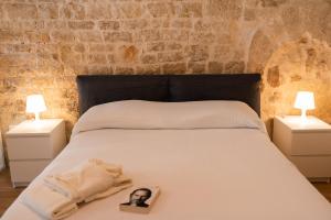 a bedroom with a bed with a picture of a woman on it at Casa Terolì in Bari