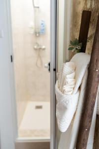 a towel rack with towels on it in a bathroom at Casa Terolì in Bari