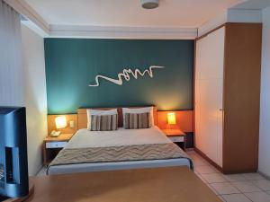 Кровать или кровати в номере Praia do Canto Apart Hotel - 302A Vista Mar