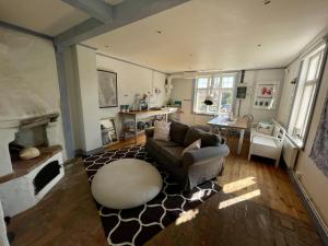 a living room with a couch and a table at Modern house in Ronneby near lake and sea in Ronneby