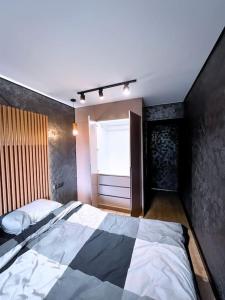 Ένα ή περισσότερα κρεβάτια σε δωμάτιο στο Black Pearl Luxury Apartment