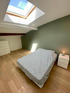 Ein Bett oder Betten in einem Zimmer der Unterkunft Loft Rochegude