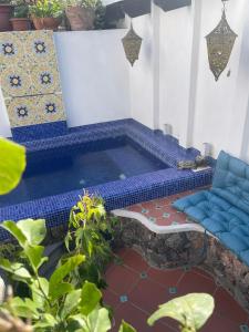 a swimming pool in the middle of a room at Smeraldino in Ischia