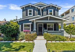 a blue house with a lawn at Walkable Luxury Designer Home in Burlingame