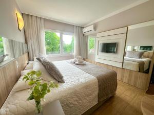 Cama ou camas em um quarto em Nadai Confort Hotel e Spa