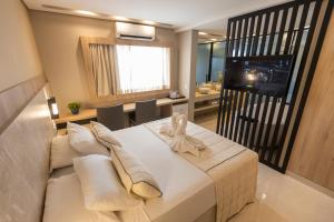 Cama ou camas em um quarto em Nadai Confort Hotel e Spa