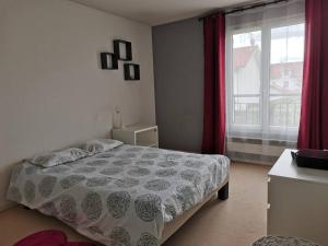 a bedroom with a bed and a large window at Belle maison spacieuse proche Genève et CERN in Saint-Genis-Pouilly