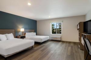 Postel nebo postele na pokoji v ubytování WoodSpring Suites Olympia - Lacey
