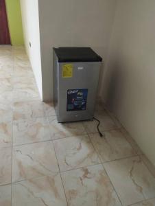 a box sitting on the floor in a room at Kiara's house in Puerto Baquerizo Moreno