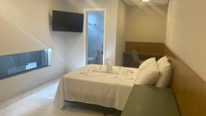 Lova arba lovos apgyvendinimo įstaigoje Neves Plaza Apart-hotel