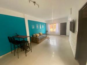 a living room with a couch and a table at Moderno Departamento en CABA 2 Ambientes con Patio in Buenos Aires