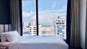 Holiday Inn Express Singapore Katong by IHG客房内的一张或多张床位