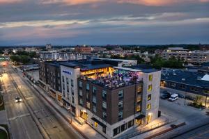 a building with a group of people on top of it at Hotel Indigo Traverse City, an IHG Hotel in Traverse City