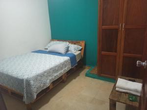 Een bed of bedden in een kamer bij Hostal Familiar Argeñal