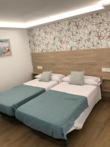 Ліжко або ліжка в номері Loft 4 Maracena centro