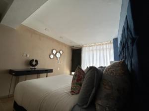 Una cama o camas en una habitación de Habitación Japandi con baño privado
