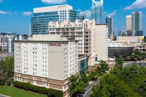 an aerial view of a large white building in a city at Hampton Inn Charlotte Uptown in Charlotte