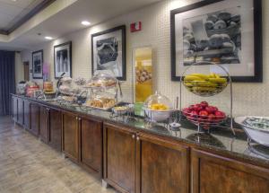 a buffet line with bowls of fruit on it at Hampton Inn Bristol in Bristol