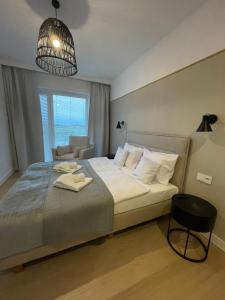 Ένα ή περισσότερα κρεβάτια σε δωμάτιο στο Golden Dunes Apartament Polanki Aqua +28 φωτογραφίες