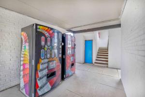 a room with two vending machines in a wall at Motel 6 Harrisburg PA Near PA Expo Center in Harrisburg