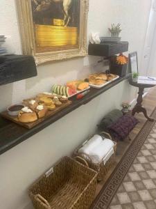 a shelf with many different types of food on it at Villa di Casa - Boutique Hotel in Wellington