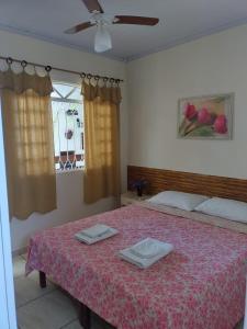 Ένα ή περισσότερα κρεβάτια σε δωμάτιο στο Pousada Linda Borboleta