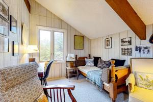 a living room with a bed and a couch at Rustic Escape in Franconia