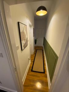 a hallway with a long hall with a hallwayngthngthngthngthngthngthngth at The Lofthouse in Blackpool